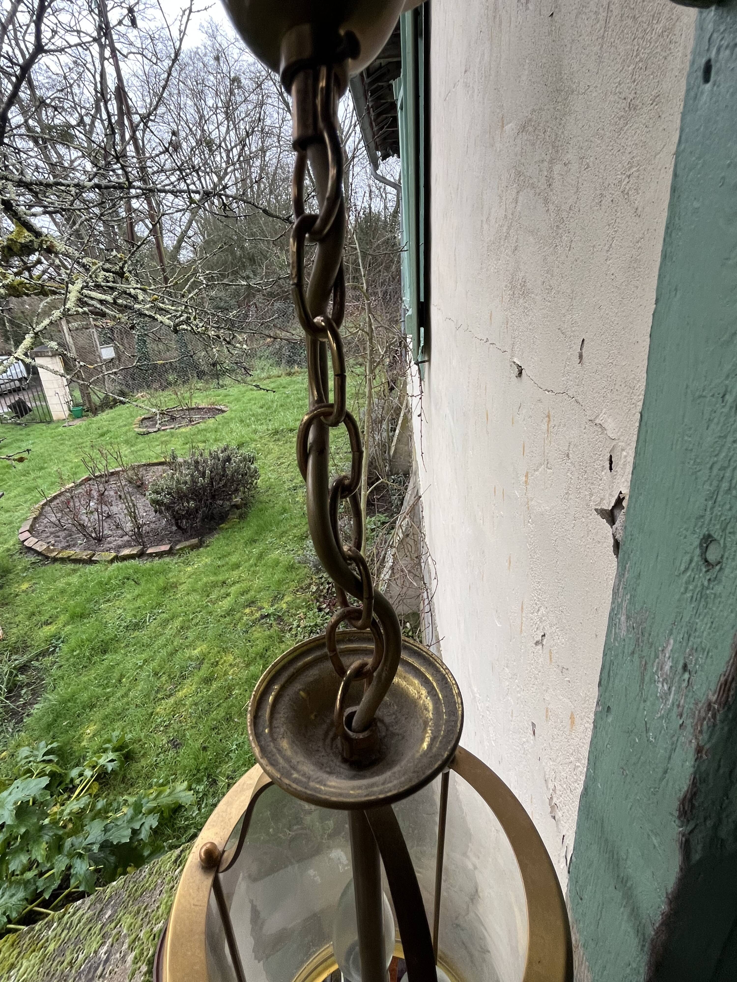Pair of glass and brass chandeliers
