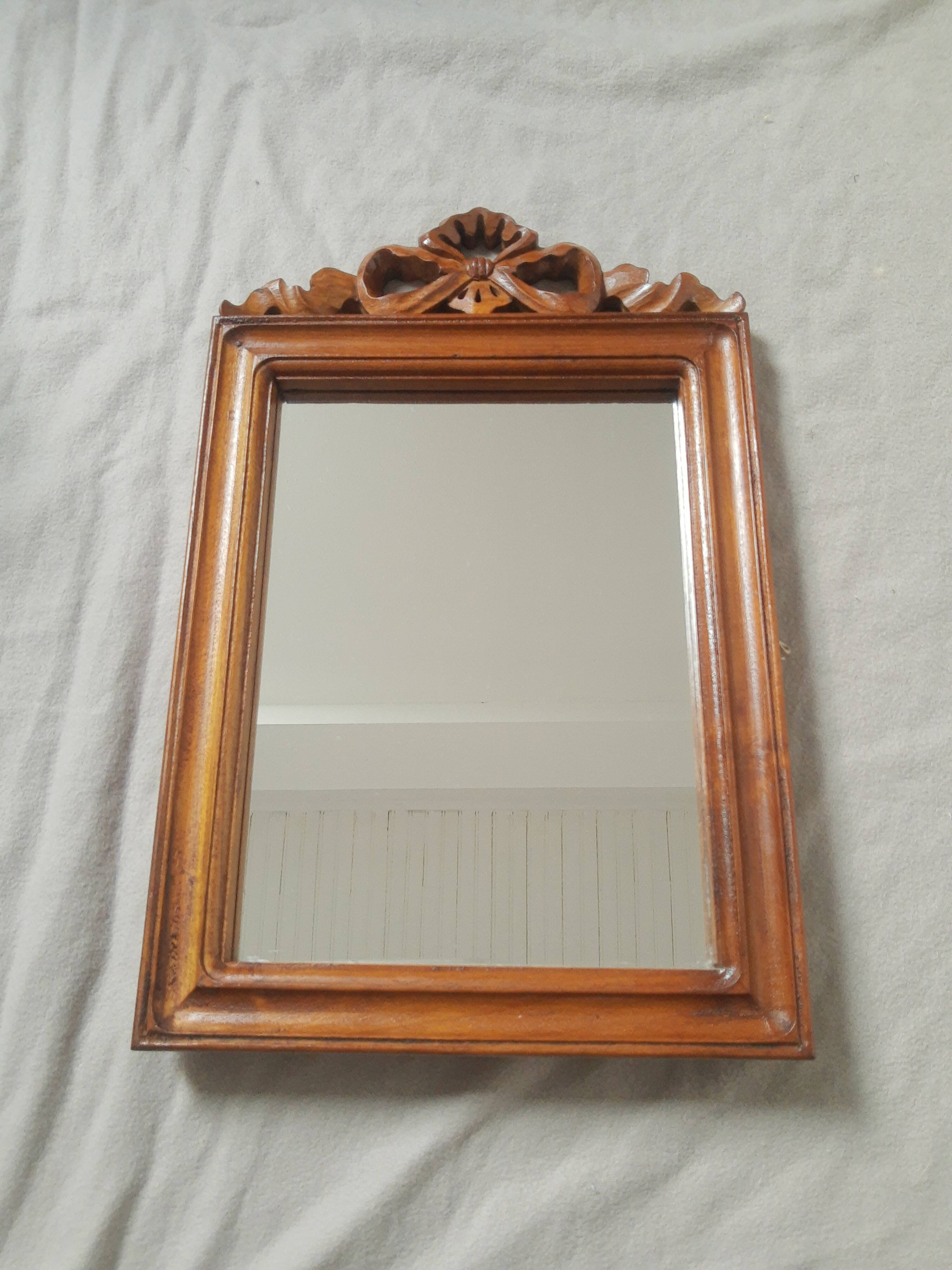 Wooden hanging mirror with vintage carved knot
