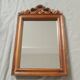 Wooden hanging mirror with vintage carved knot