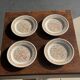 Set of 4 small dessert plates with a vintage stylised flower pattern.