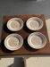 Set of 4 small dessert plates with a vintage stylised flower pattern.
