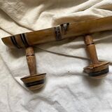 Antique wall-mounted coat rack in turned bamboo-style wood