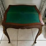 Console transforming into a 19th century Louis XV style gaming table