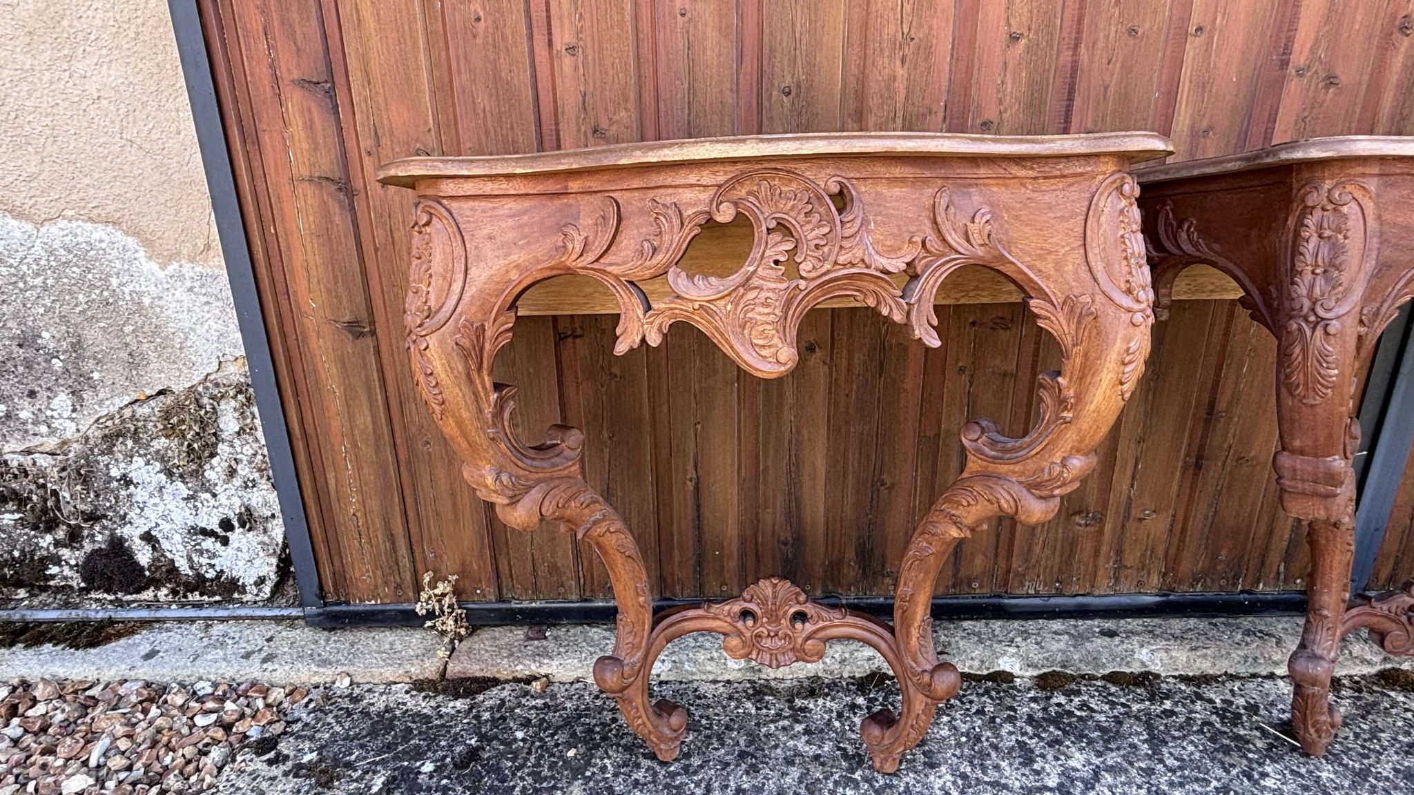 Pair of carved wall consoles in Louis XV style
