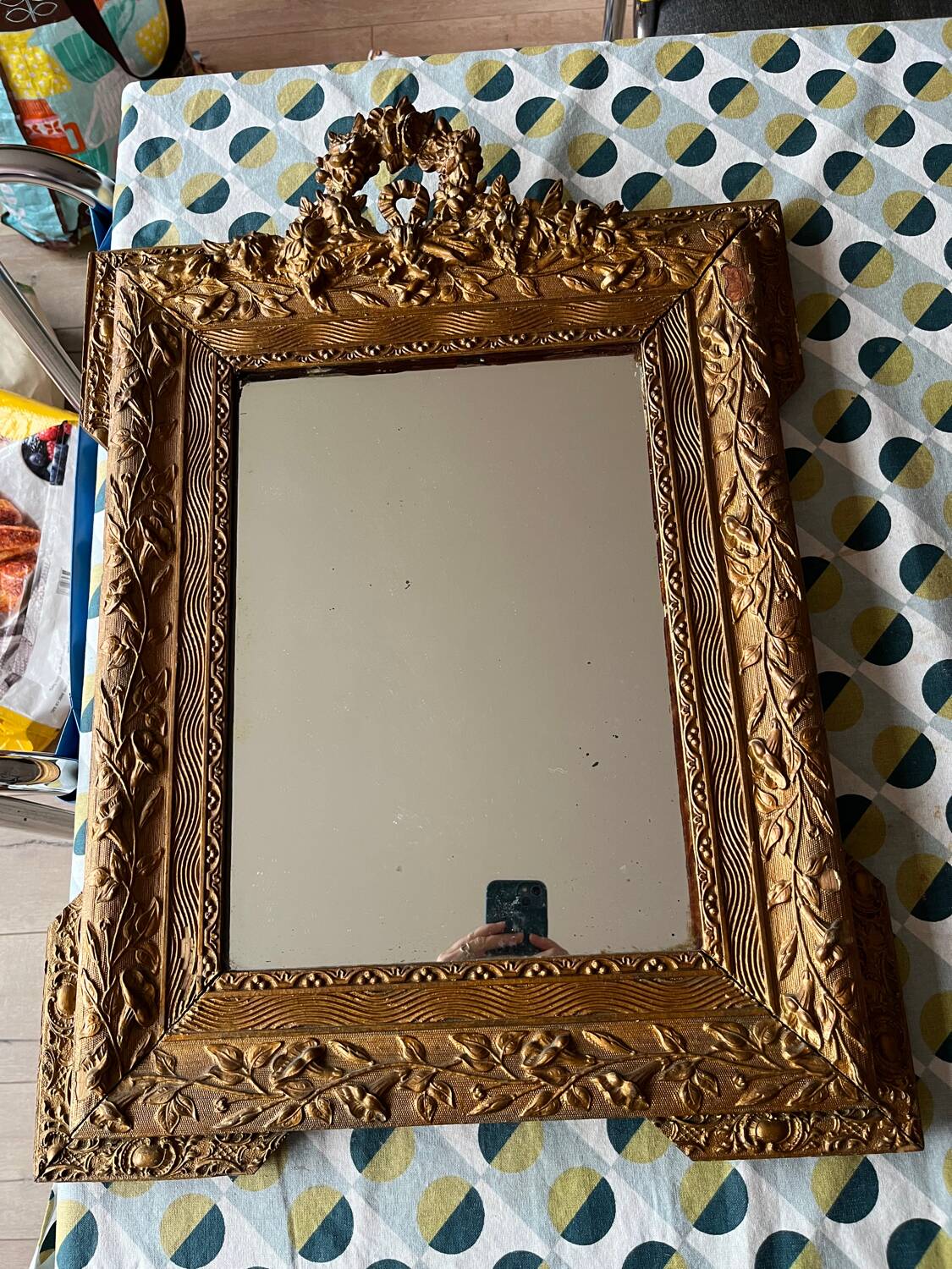 Golden trumeau mirror for fireplace, late 19th century, with sculpted pediment.