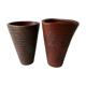 Pair of red enamelled terracotta vases, signed