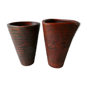 Pair of red enamelled terracotta vases, signed