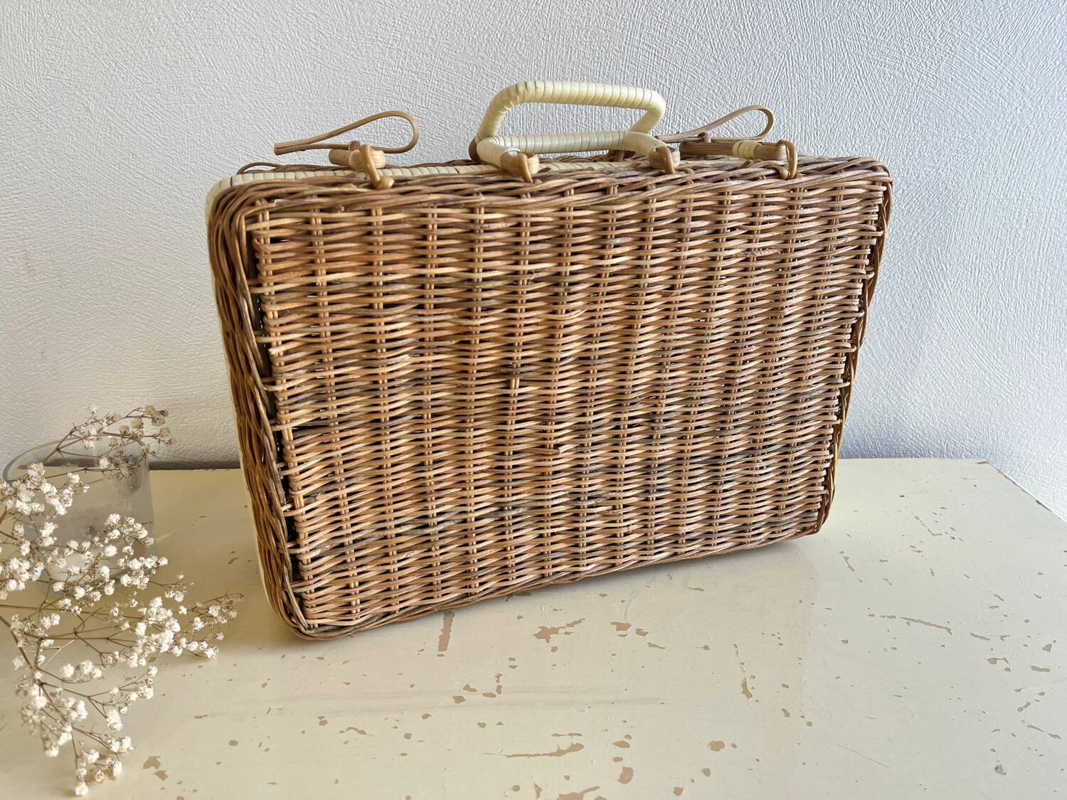 Vintage woven wicker suitcase