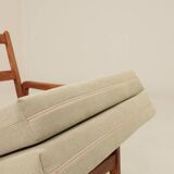 Vintage armchair in olive corduroy with a wooden frame.