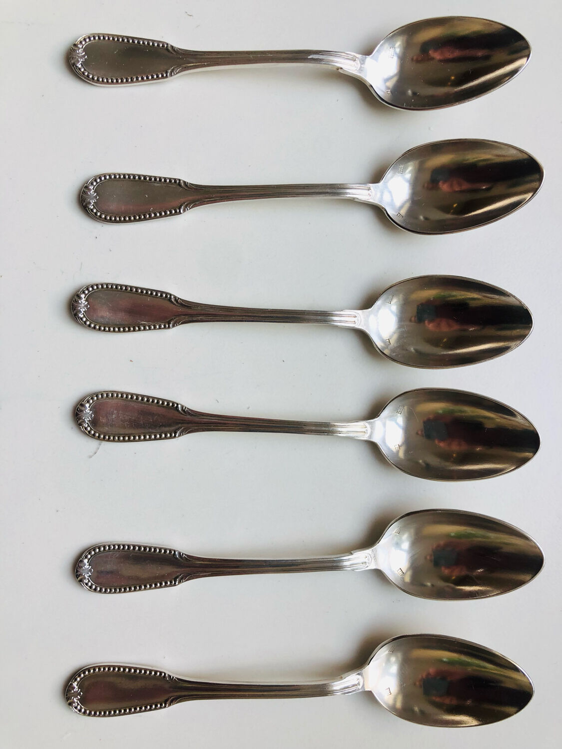 6 small silver metal spoons