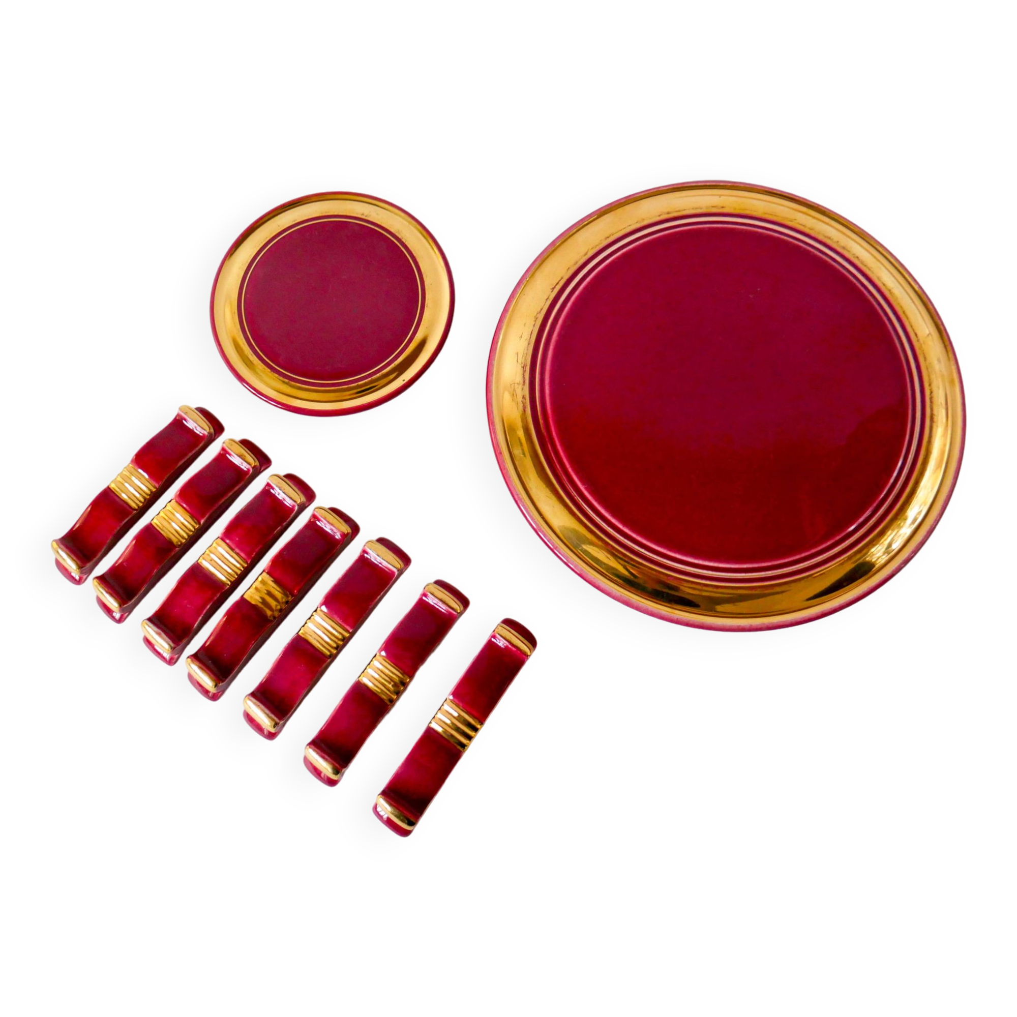 set of trivets, bottle coasters and knife holders in art de cherry-colored ceramic