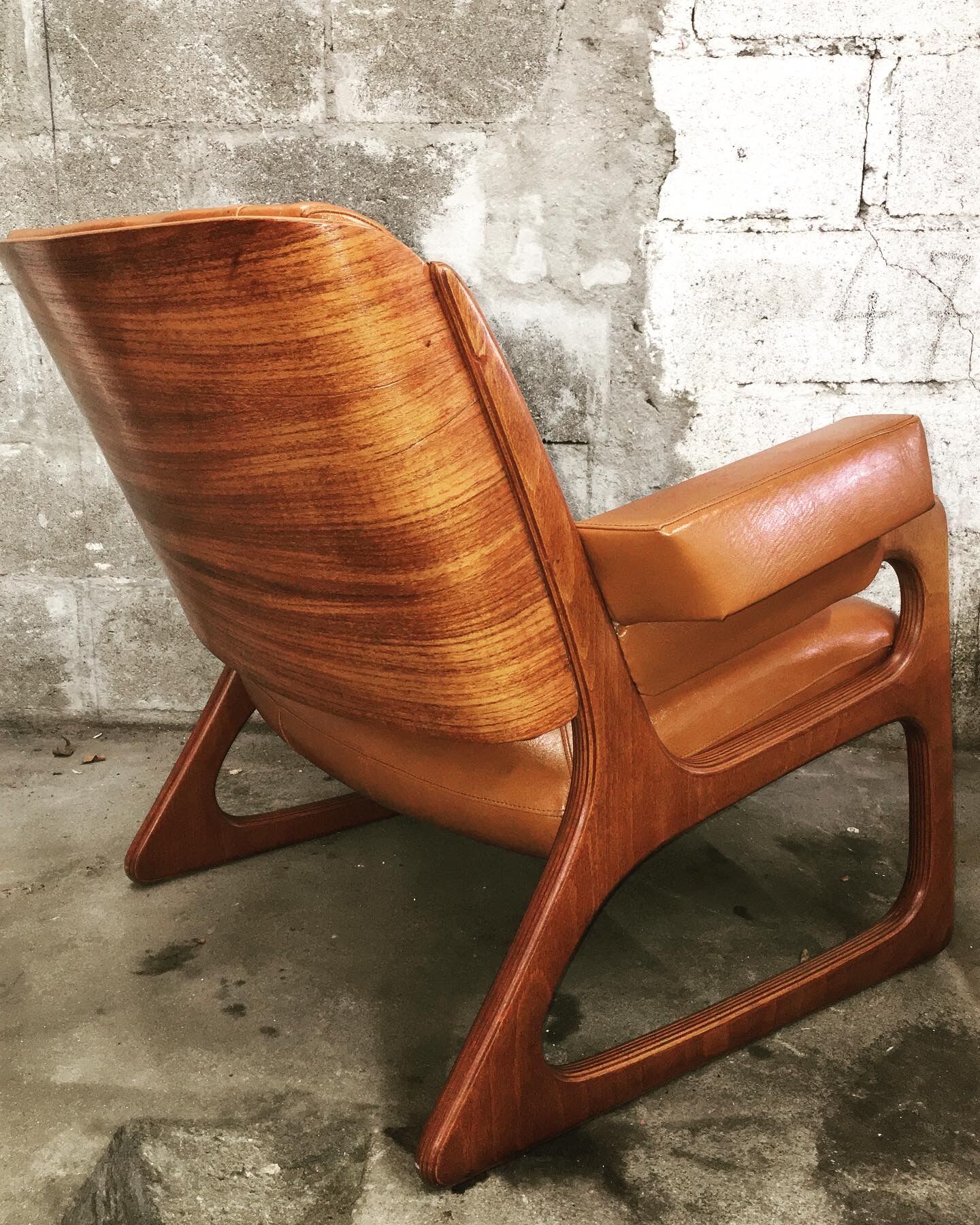 Armchair called "sled" Publisher Baumann and Ottoman