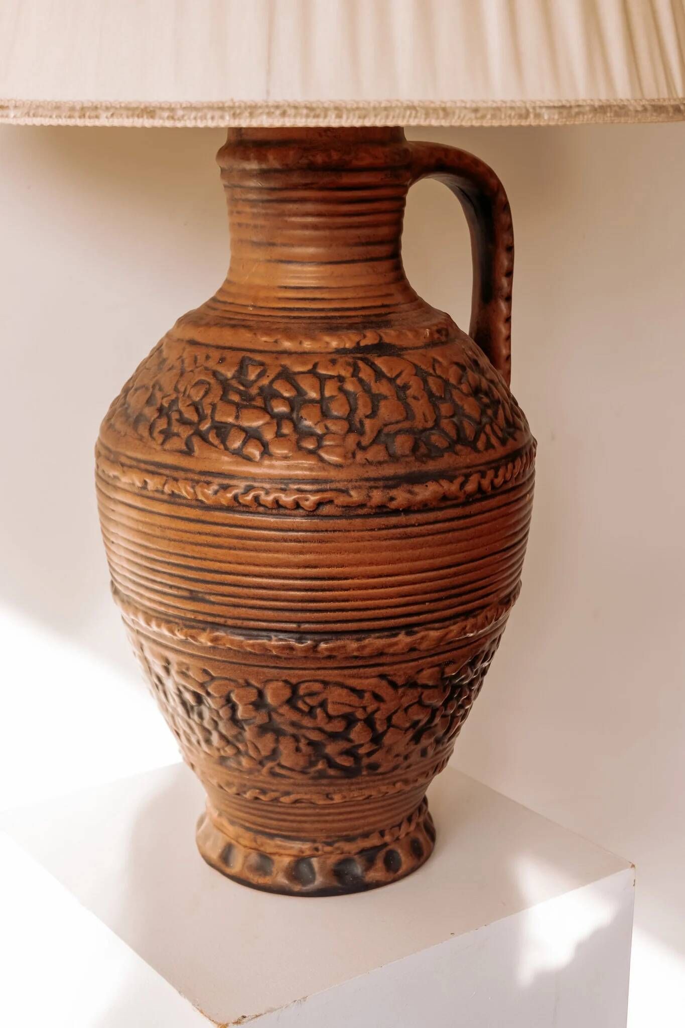 Large ceramic table lamp from West Germany with a pleated shade.