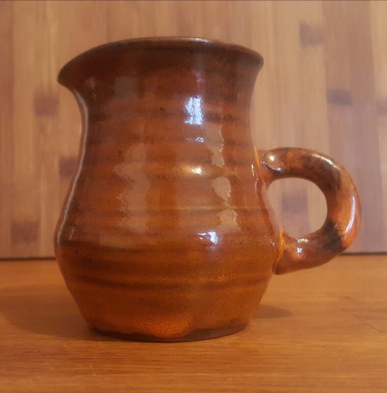 Ceramic milk pot creamer with orange glaze