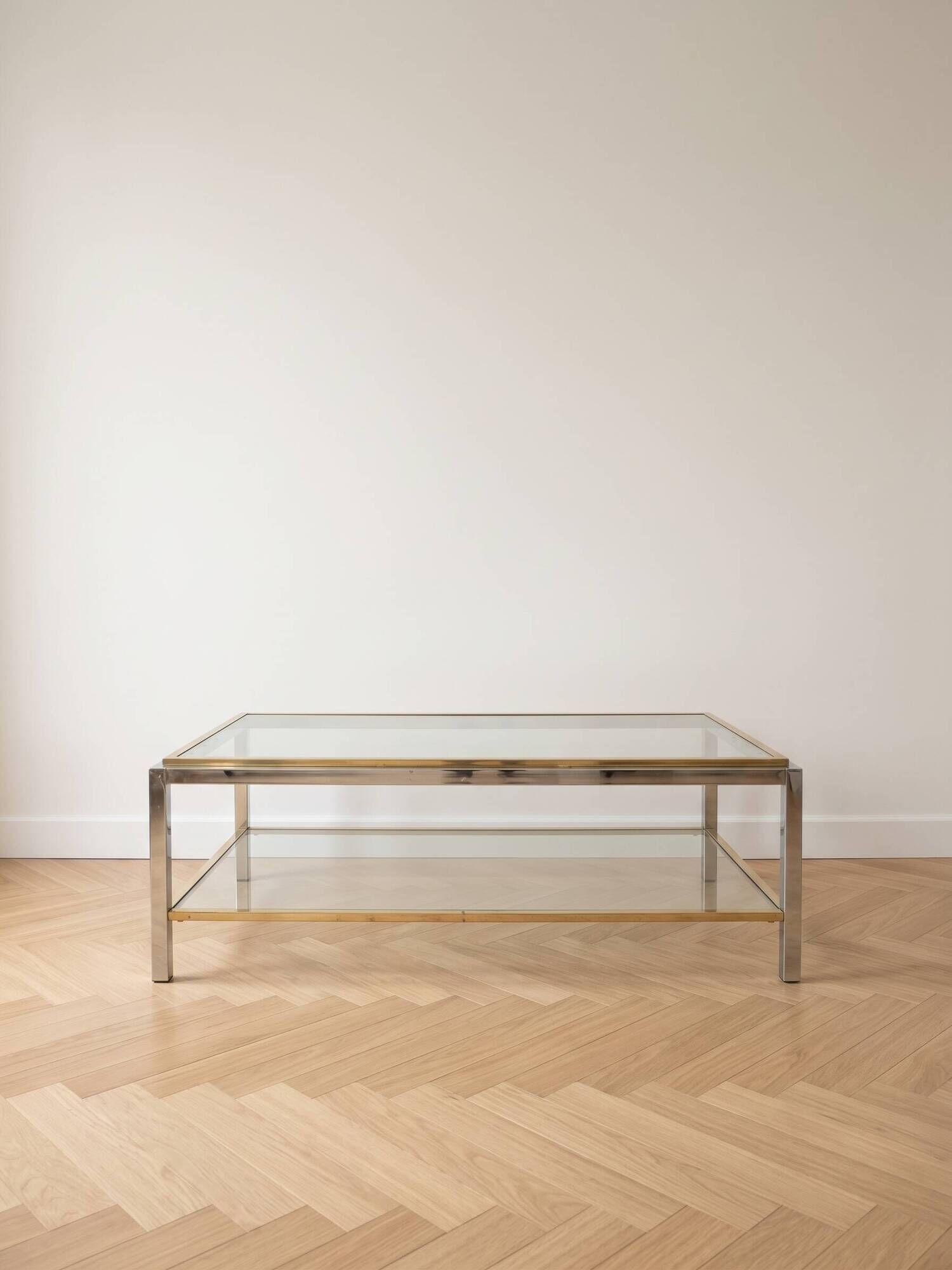 Vintage 1970s coffee table in brass and chrome in the style of Willy Rizzo.