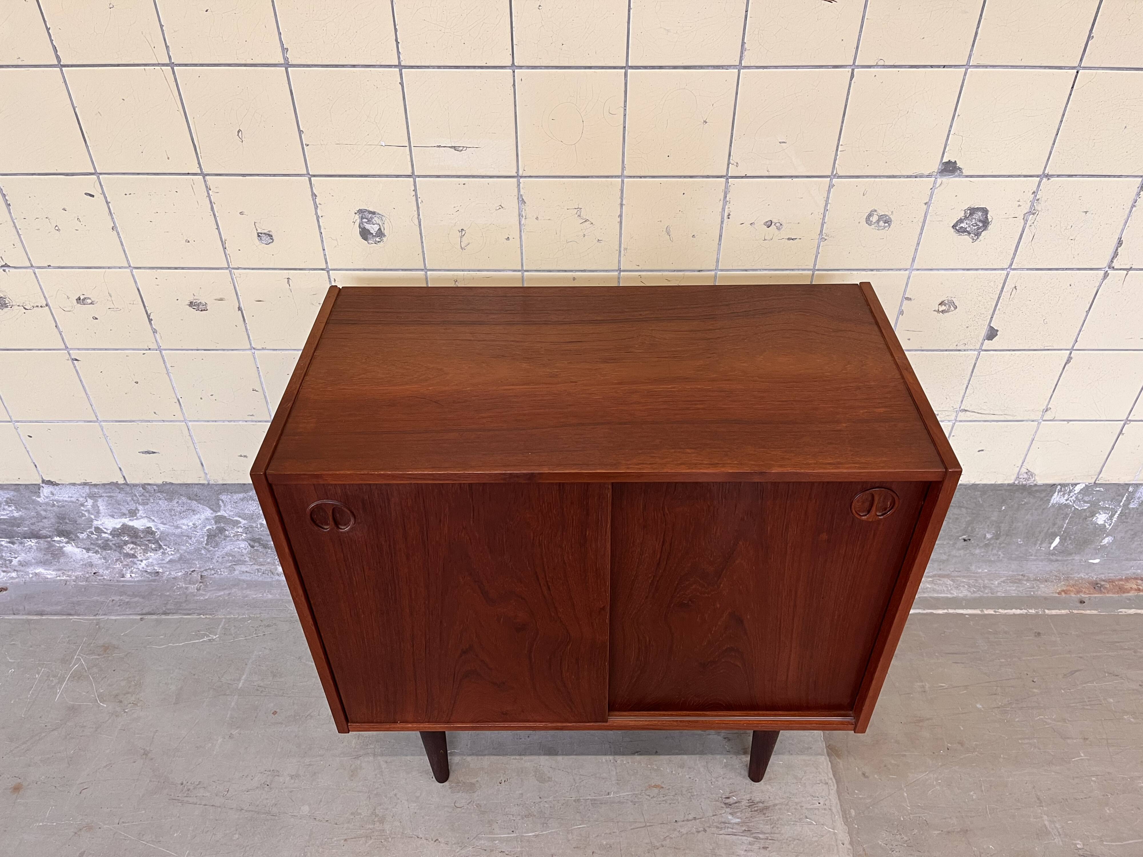 Vintage Danish cabinet with sliding doors
