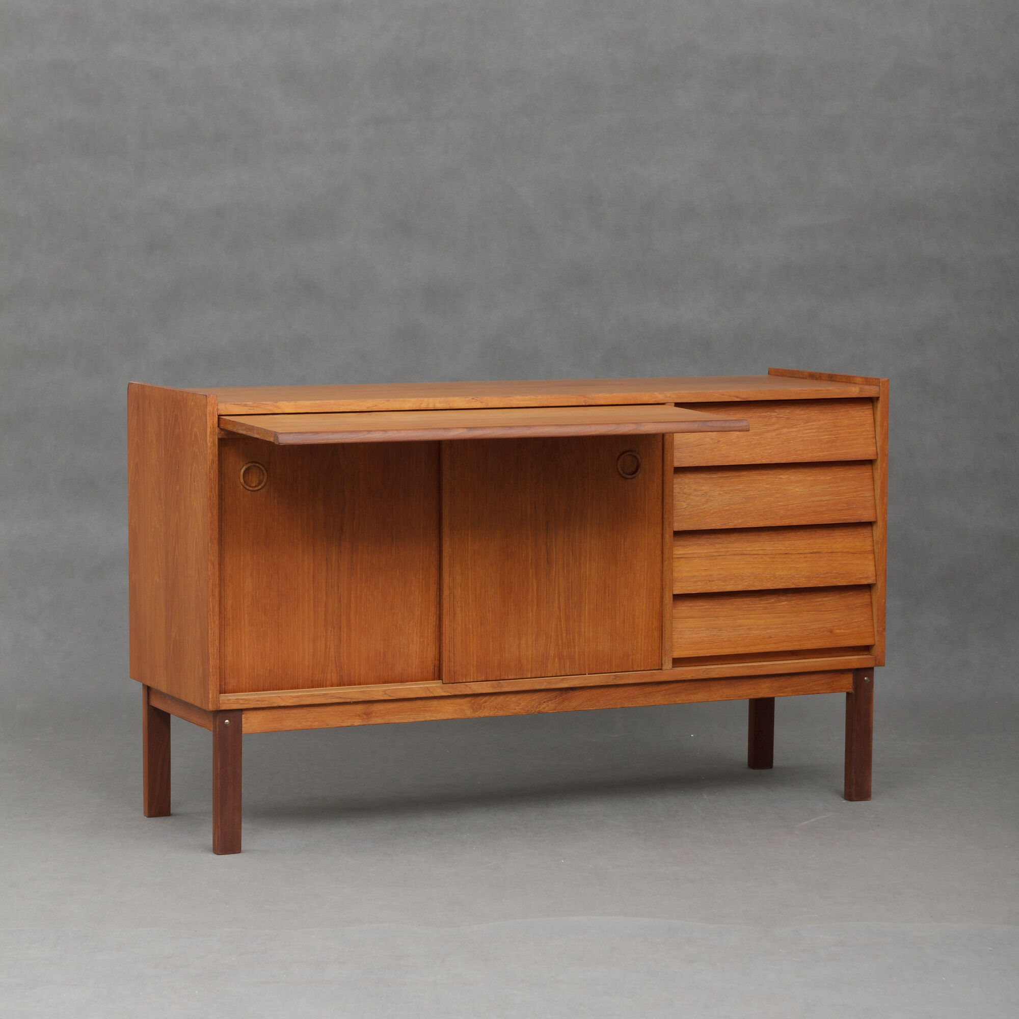 Small Danish teak sideboard with a pull out tray