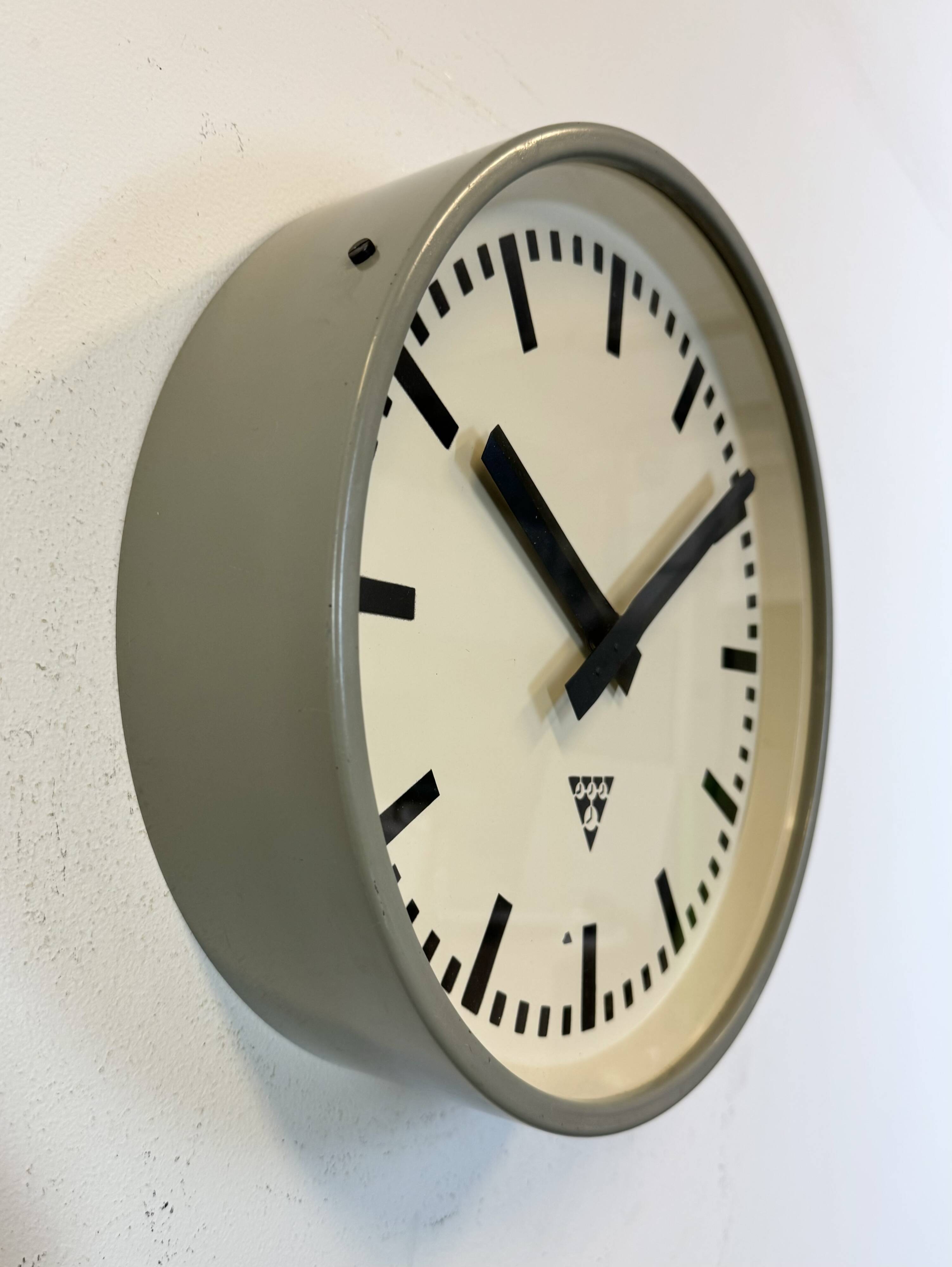 Industrial grey factory wall clock from pragotron, 1960s