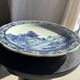 Vintage hollow circular plate in blue and white Boch pottery.