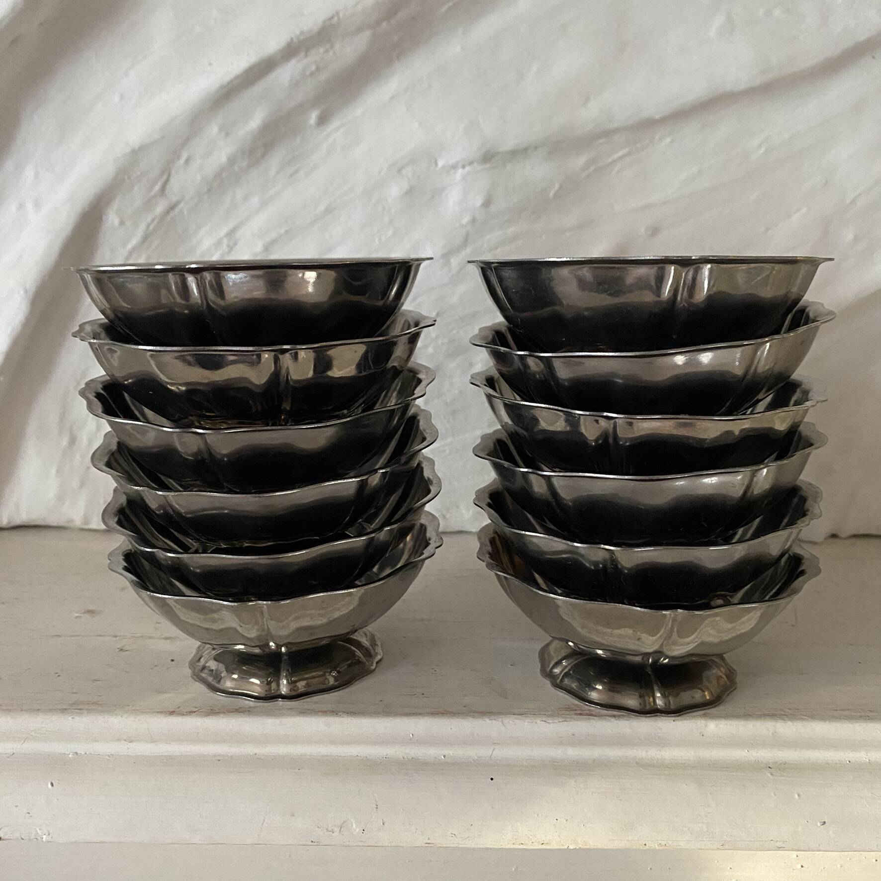 Stainless steel ice cream bowls for one scoop.