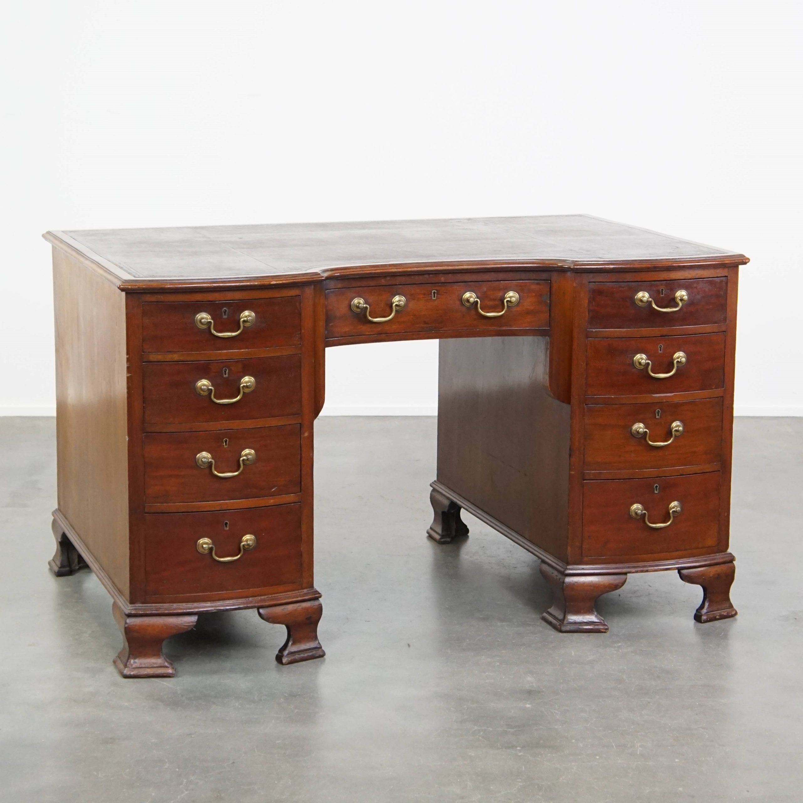 Antique English wooden desk from the late 19th century with a leather top