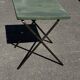 Folding garden or bistro table in khaki sheet metal from the early 1950s.
