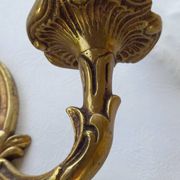 Old pairs of bronze wall sconces