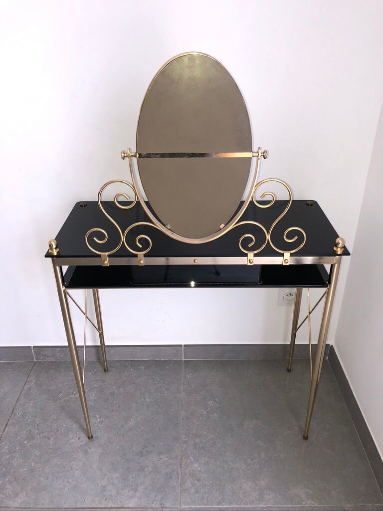 Brass hairdresser, glass and black plastic with its fluffy stool.