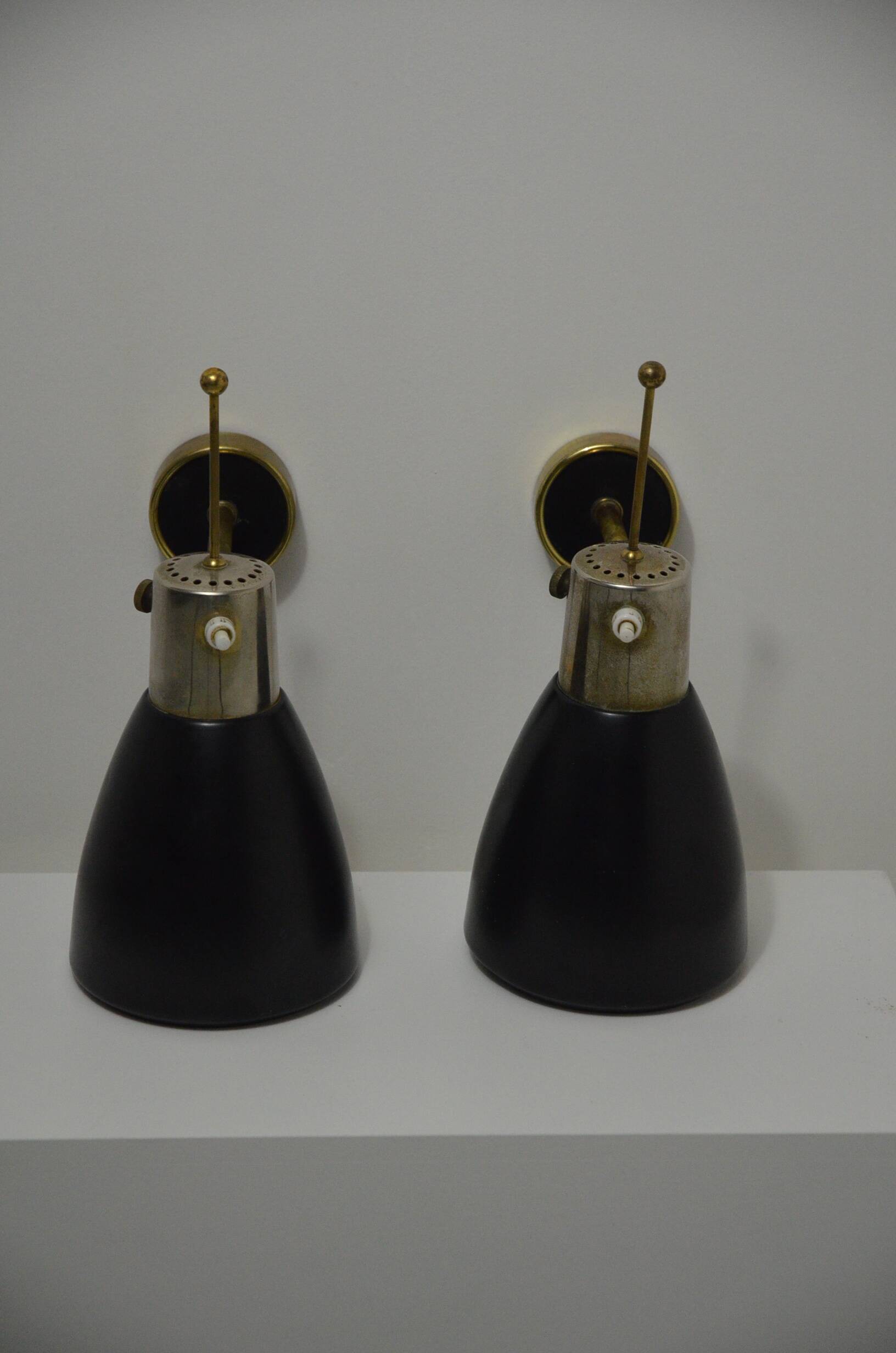 Pair of Monix wall lights in black lacquered metal and brass