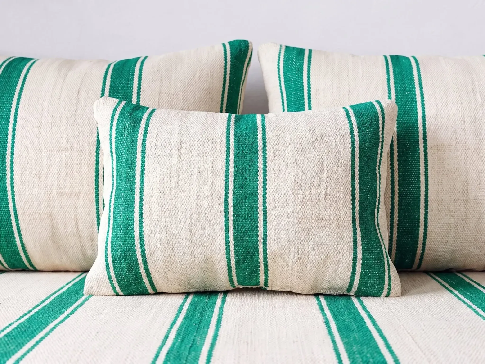 Emerald striped Moroccan living room set with pouf.