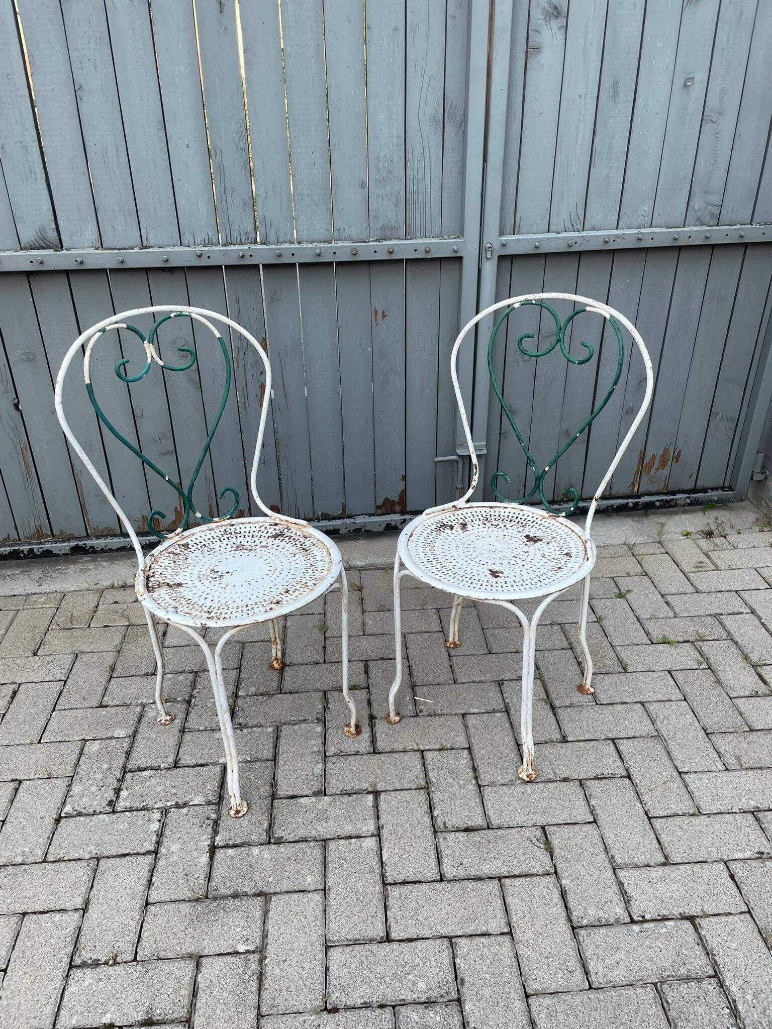 pair of antique wrought iron garden chairs