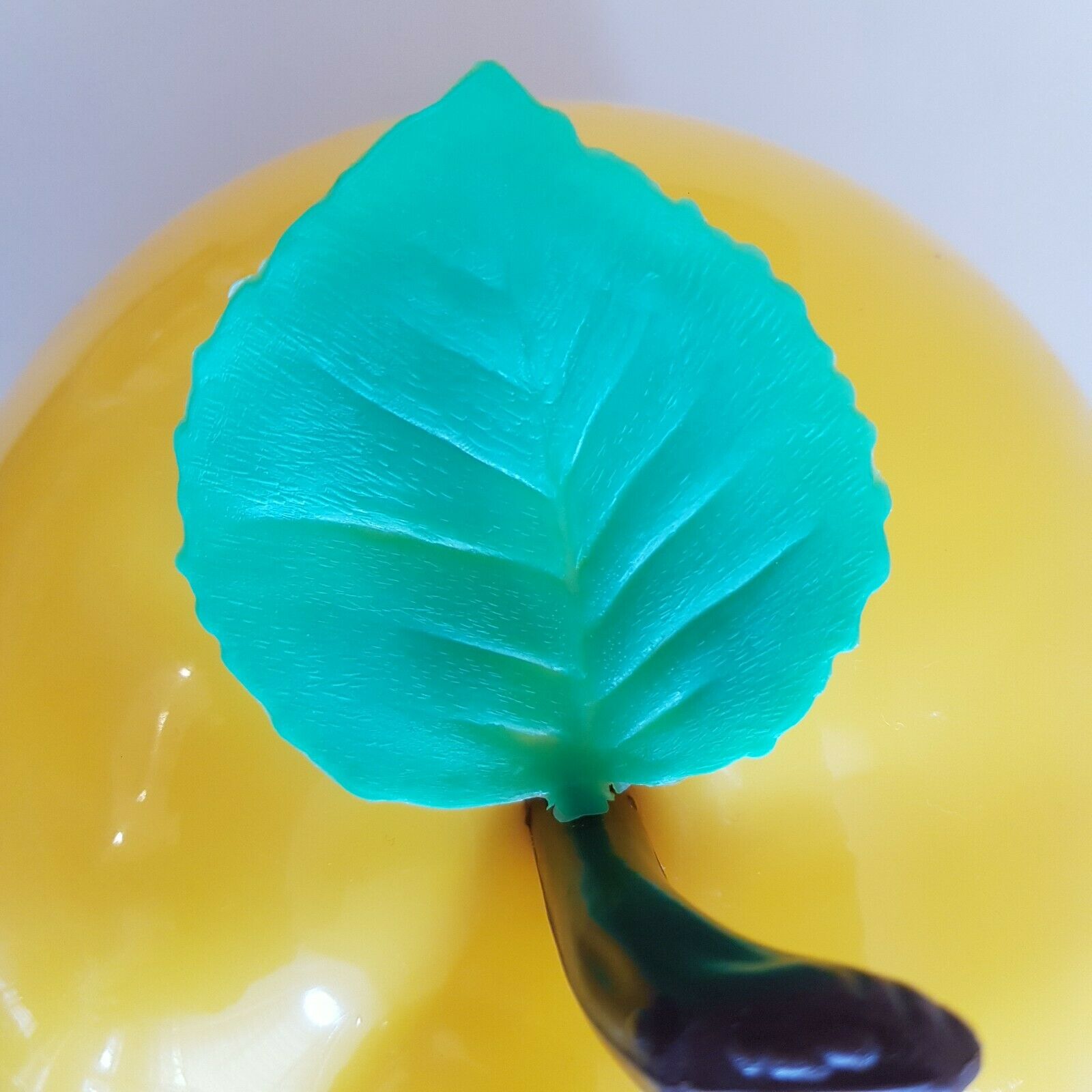 Vintage yellow apple-shaped plastic ice cube tray