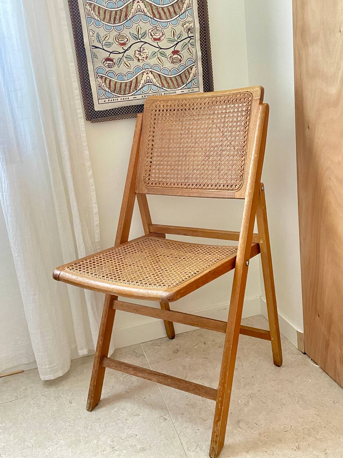 Folding wooden and cane chair