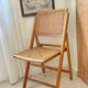 Folding wooden and cane chair