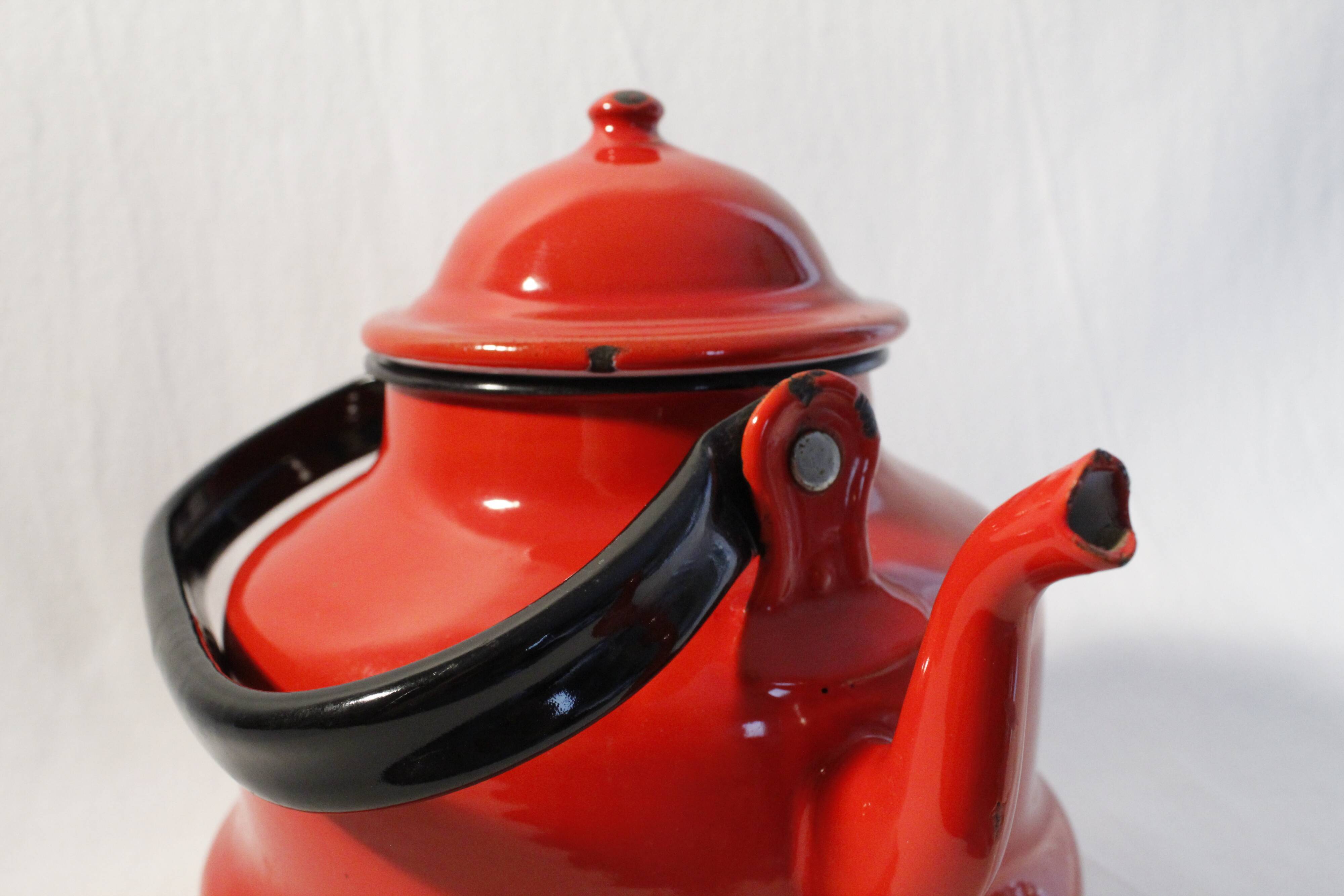Vintage red enamelled metal kettle