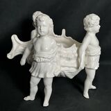 Porcelain, centerpiece with candle holder decorated with putti, 20th century