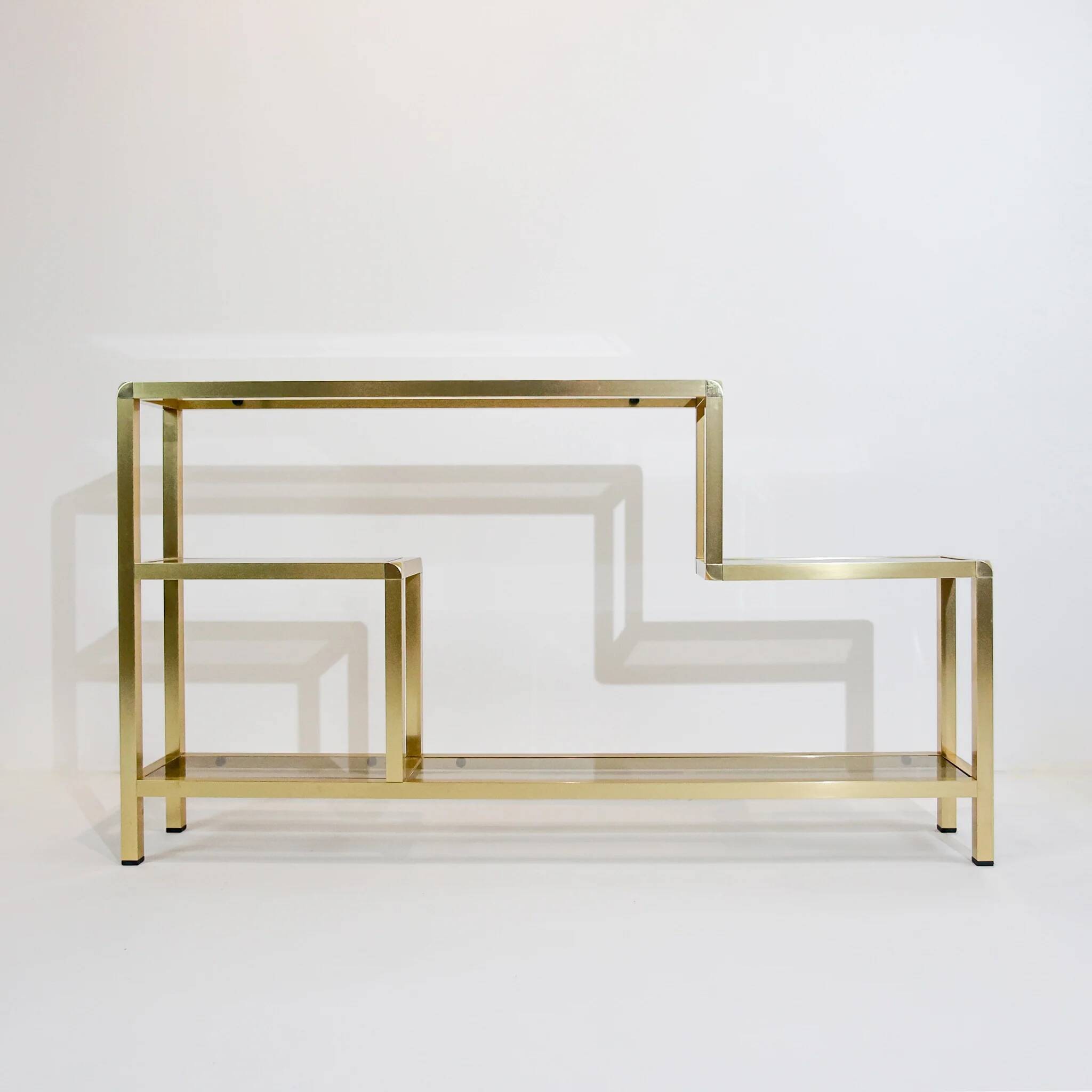 Vintage shelves in brass and smoked glass.
