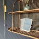 Steel and wicker wall shelf