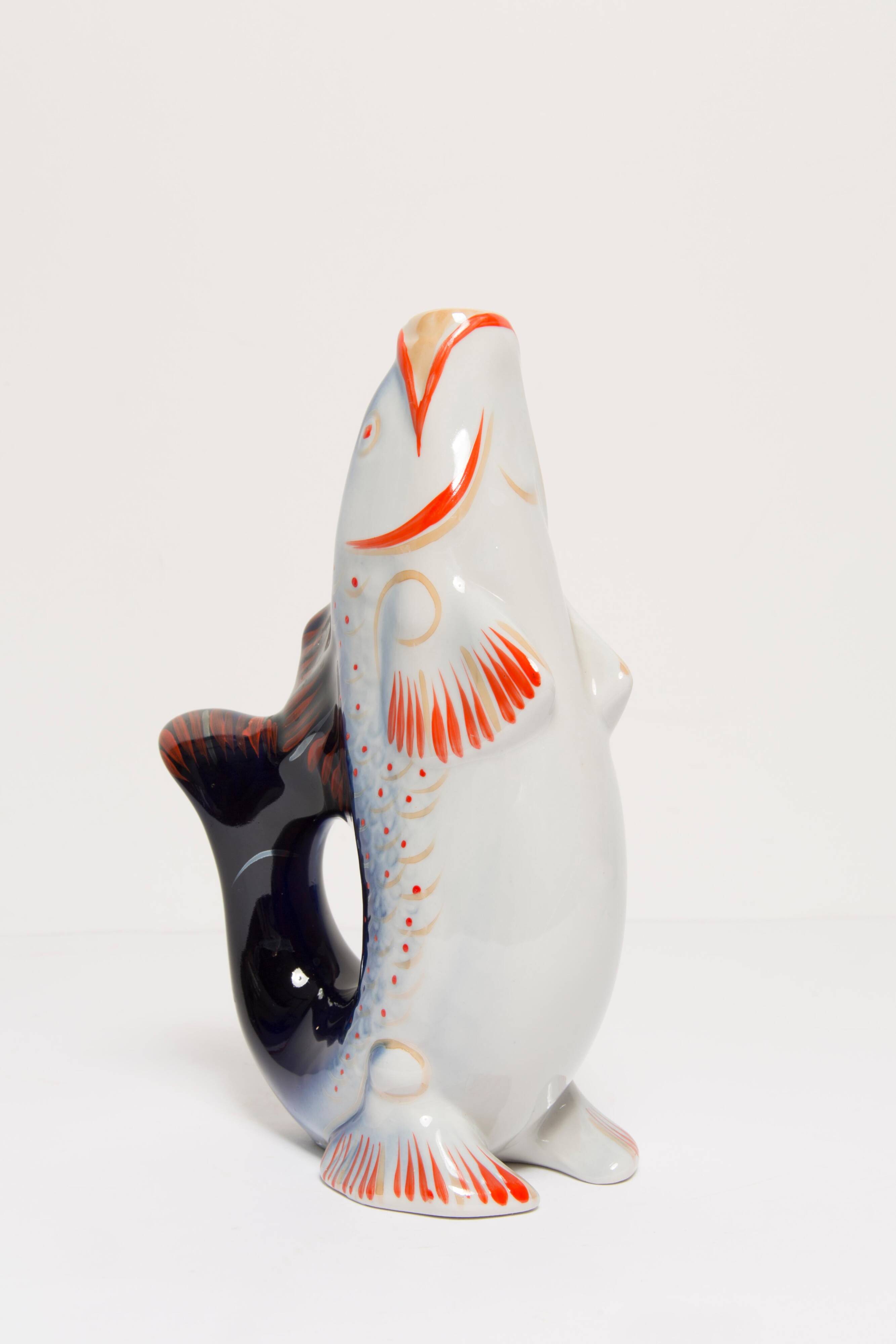 Set of 7 blue glass fish, mid-20th century.