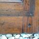 Oak entrance door and its frame and transom, wrought iron gates