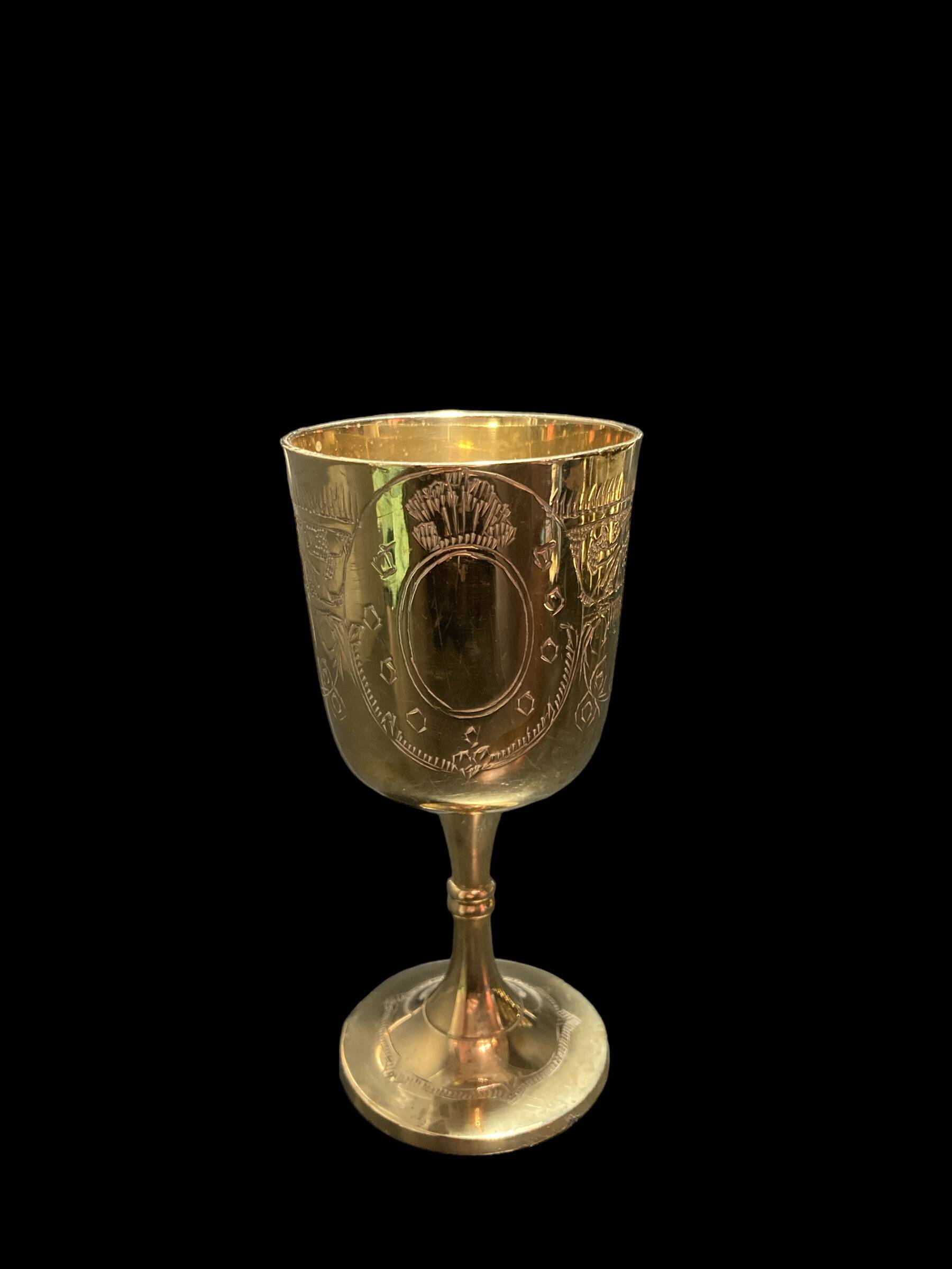 Set of six gold metal glasses