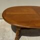 Oak dining table, oval living room table with two extensions.