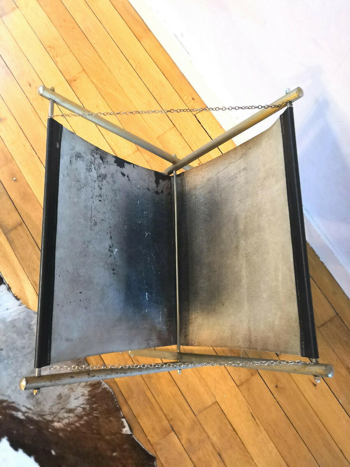 Wearing leather and brass magazines rack