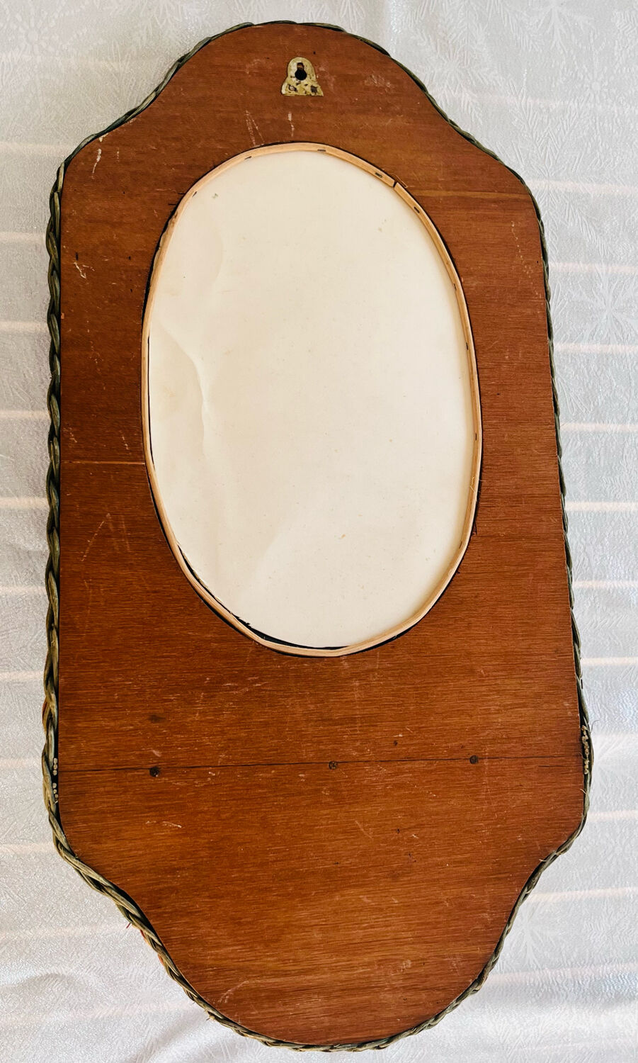 Oval wicker mirror