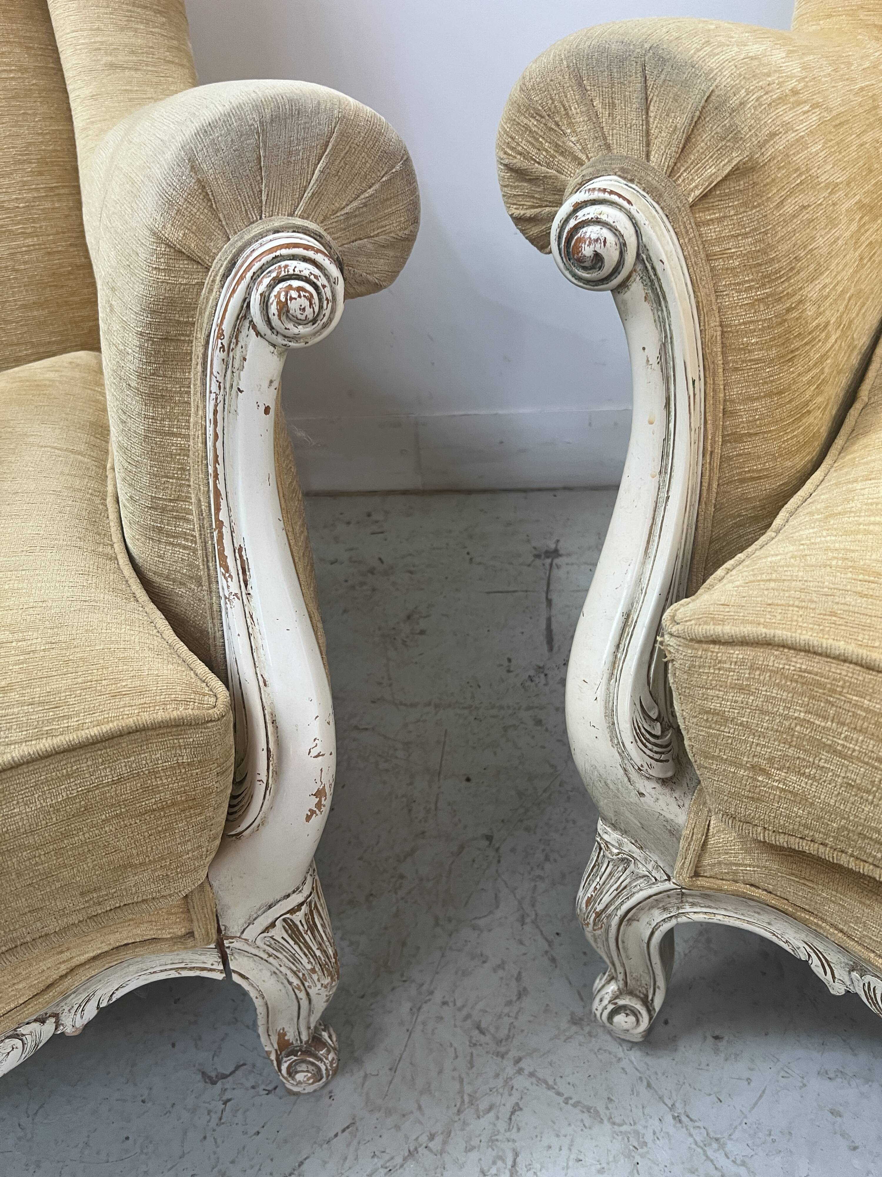 Pair of Louis XV style wing chairs in patinated beech, 20th century