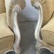 Pair of Louis XV style wing chairs in patinated beech, 20th century