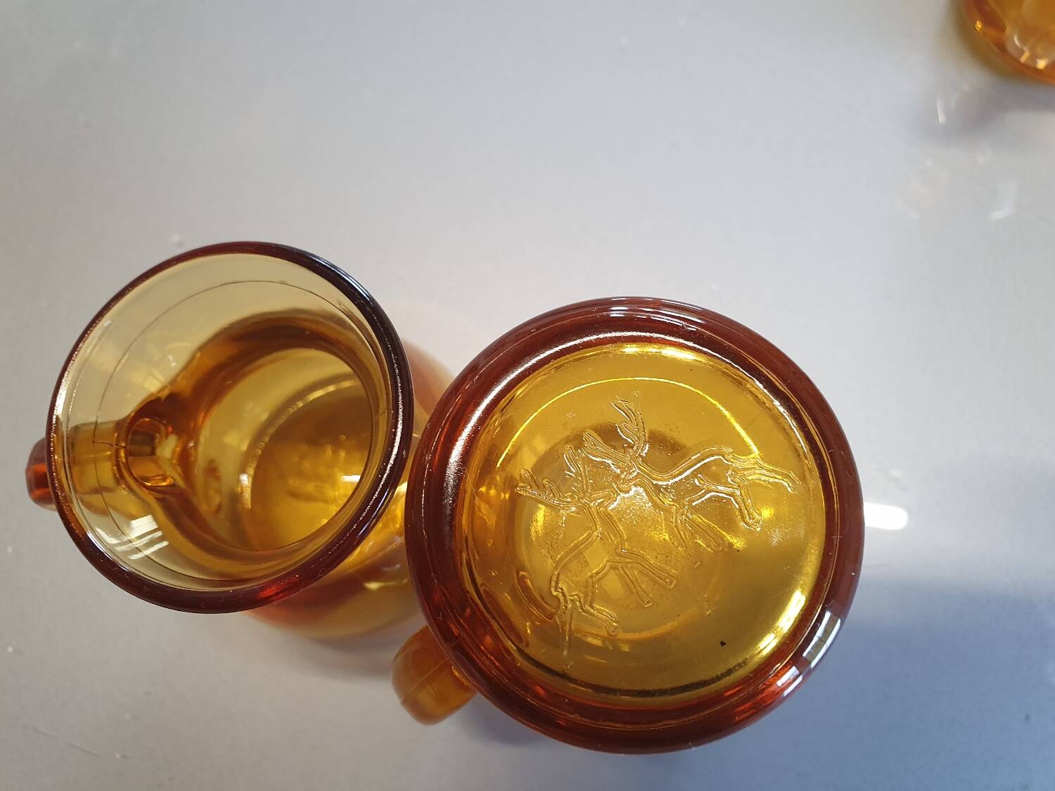 Set of original vintage small amber glass glasses.
