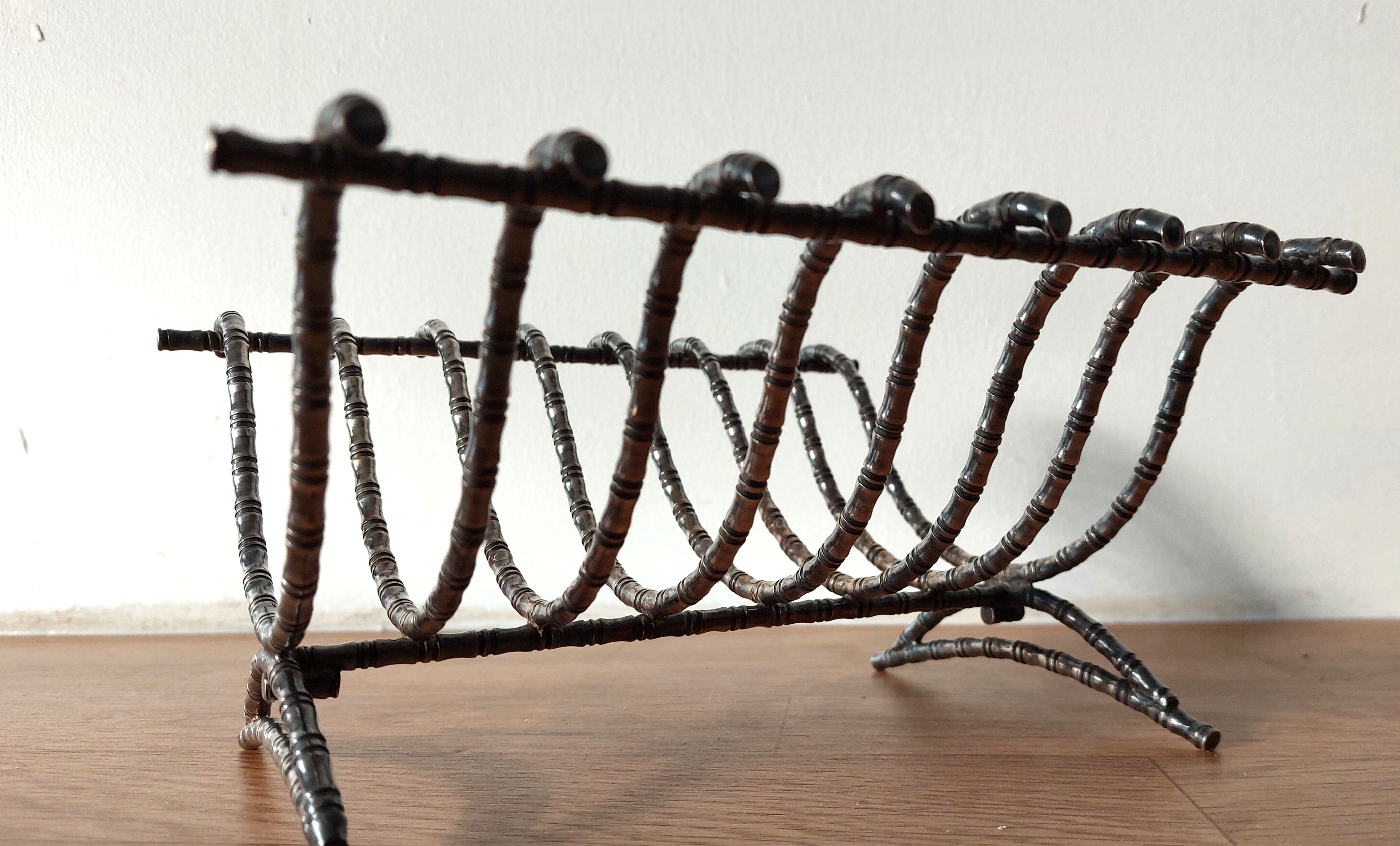 Silver metal cut in imitation of vintage bamboo.