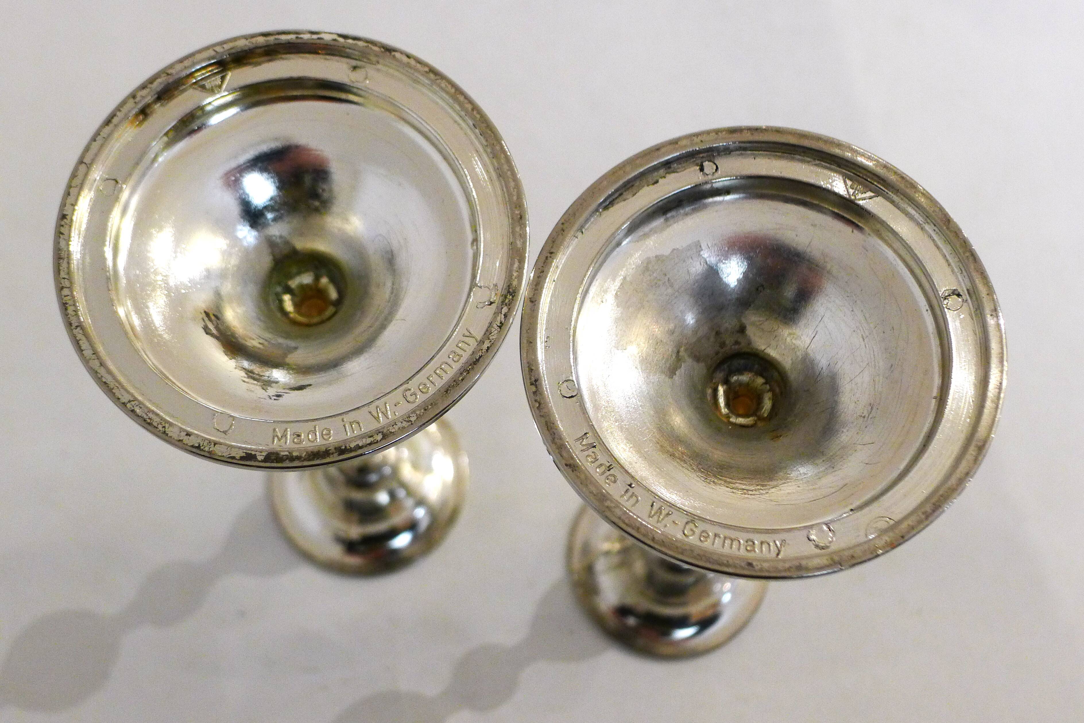 Pair of metal candle holders