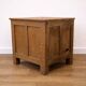 Oak side cabinet with carved motifs